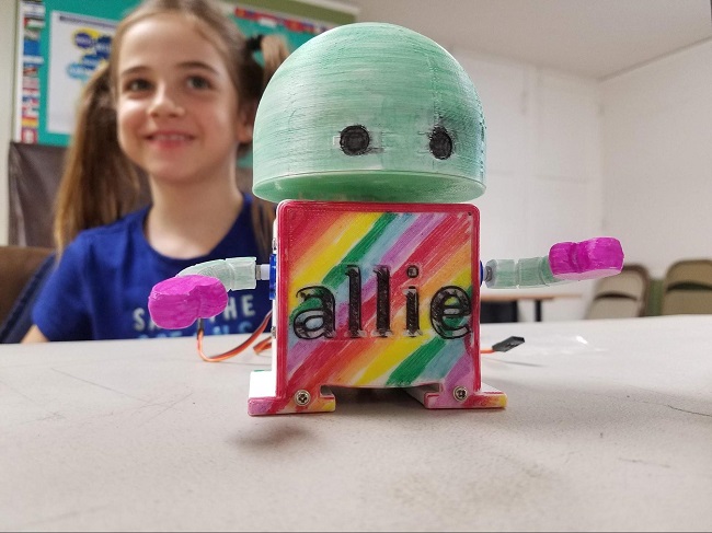 student with finished robot